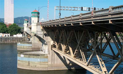 The bridge’s main bascule span was rehabilitated in 2007. The concrete deck—one of the world’s largest for a bascule drawbridge—was rutted and cracked.