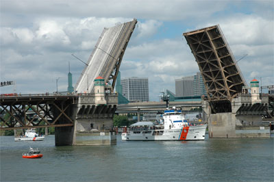 The Coast Guard Cutter Steadfast passes under the Burnside Bridge on its way to Portland, OR.