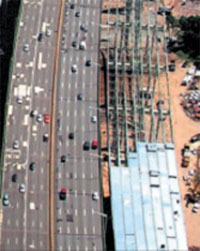 A six-year project completed in 2009 expanded the bridge to 15 travel lanes and six shoulder lanes, making it wider than the George Washington Bridge.