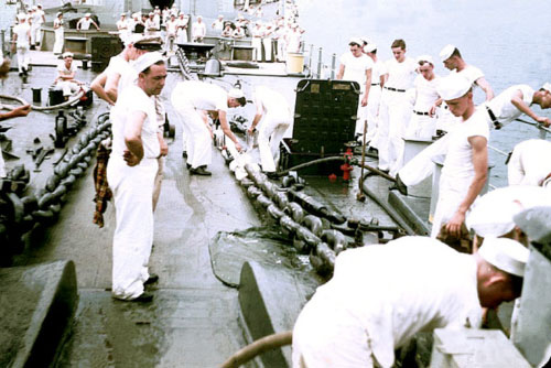 Painting crews go to work on the battleship’s chains in the 1940s.